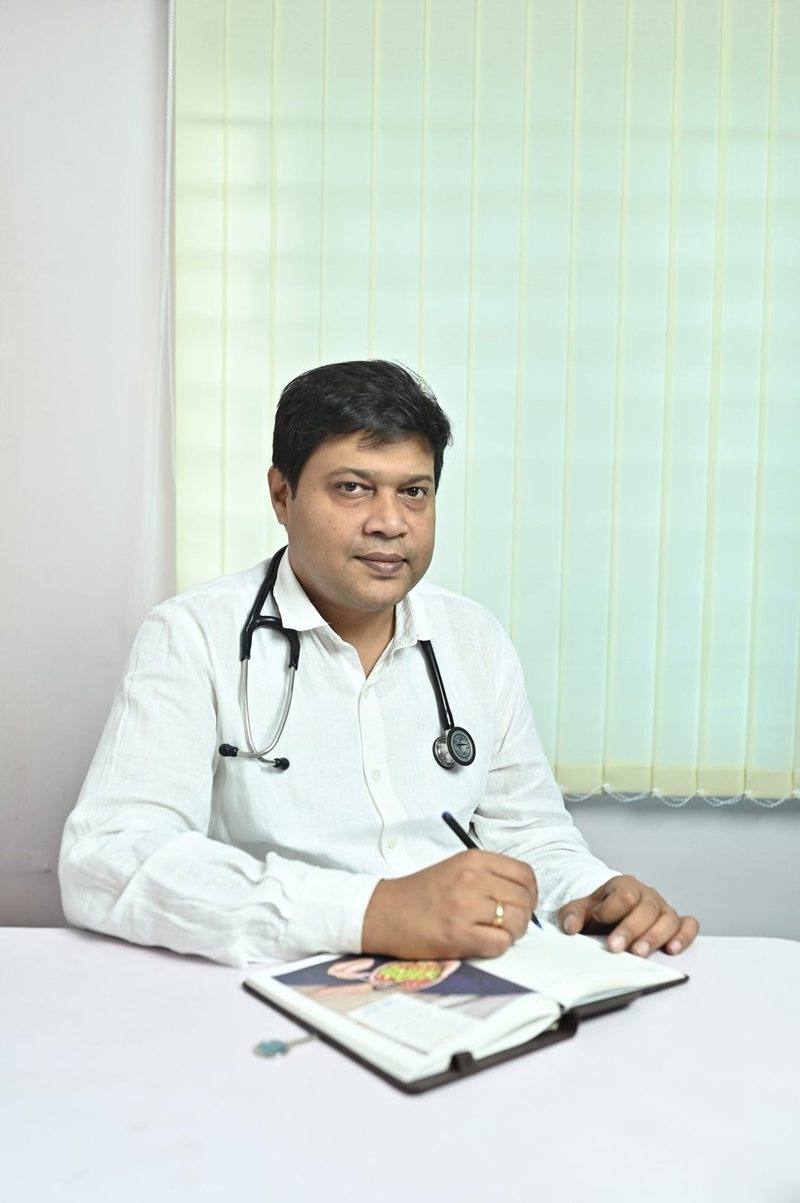 Dr Soumya Ghosh at his desk at Uttarbanga Clinic, Cooch Behar, in an earlier year