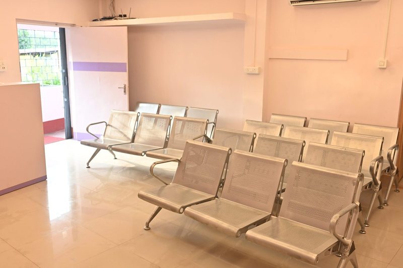 Waiting hall with the original seating at Uttarbanga Clinic, Cooch Behar