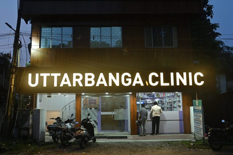 Uttarbanga Clinic entrance lit at night, Sunity Road, Cooch Behar