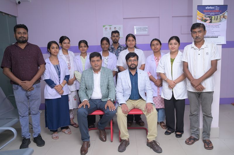 The full staff of Uttarbanga Clinic, Sunity Road, Cooch Behar, photographed in the waiting hall